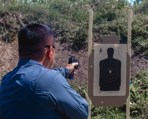 Armed officer achieves Florida G License Requalification with target practice.